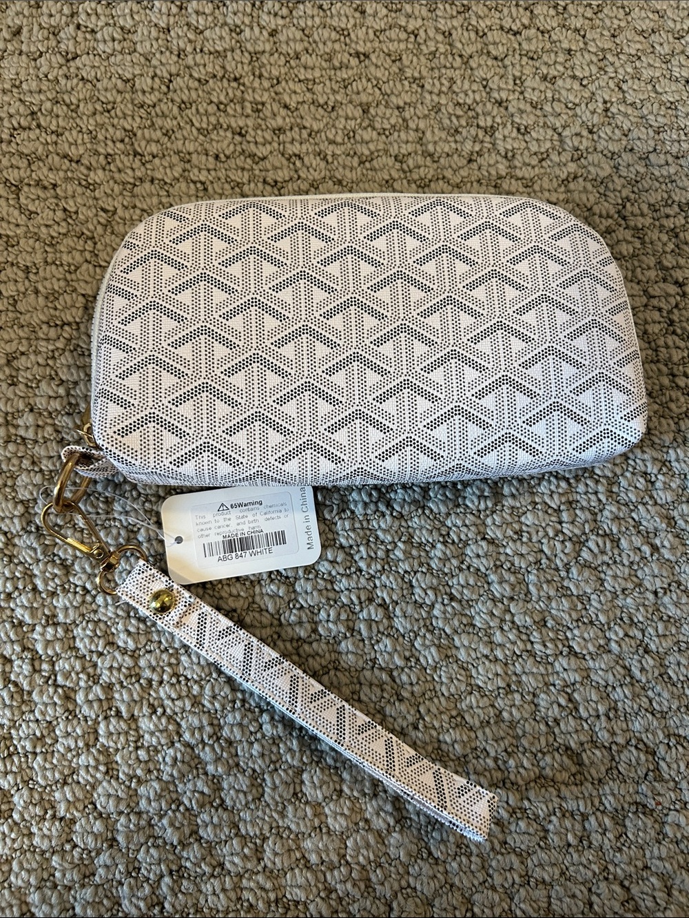 White Perforated Wristlet Clutch with Geometric Pattern